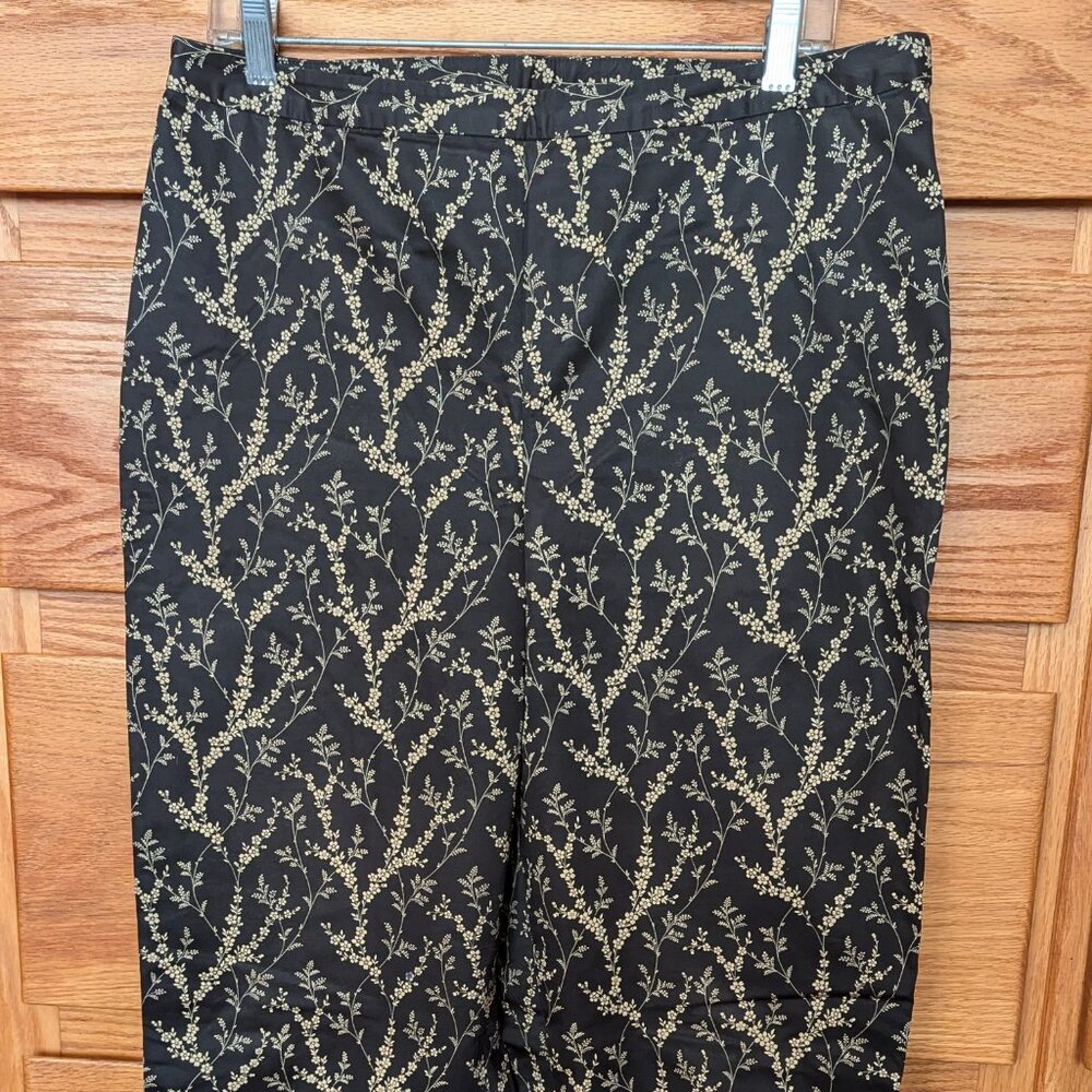 Ann Klein black cotton sateen pants size 12 with sprays of golden flowers.